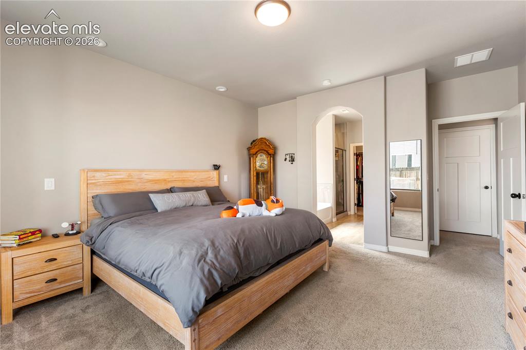 Image 10 of 20: Large primary bedroom on main level