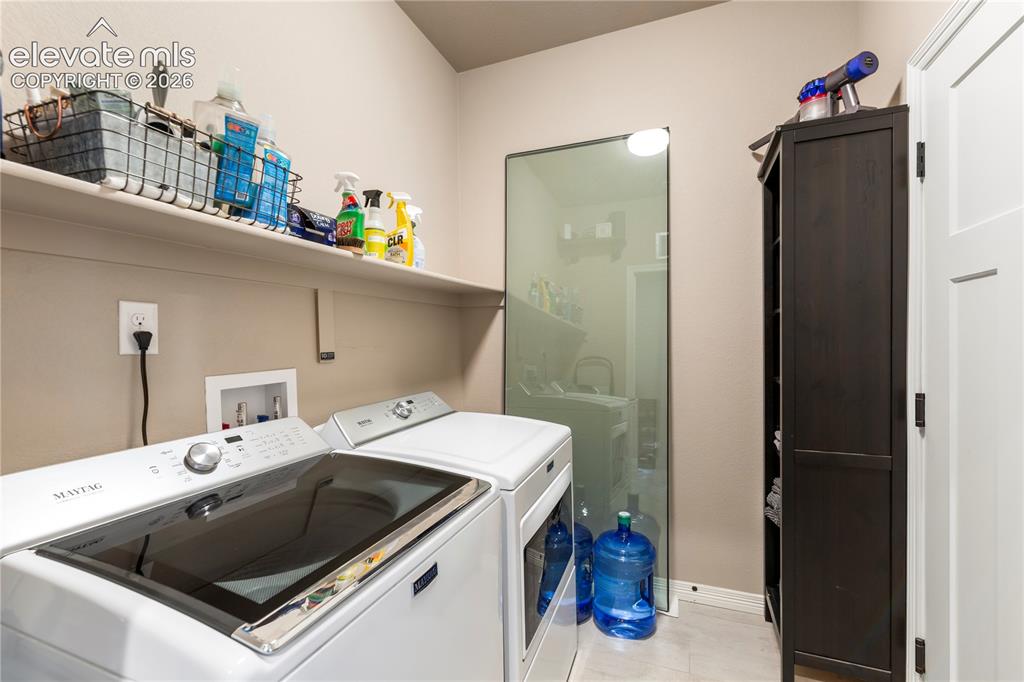 Image 16 of 20: Spacious laundry room on main level