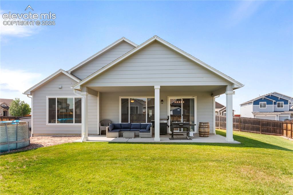 Image 17 of 20: Huge covered patio off rear of home