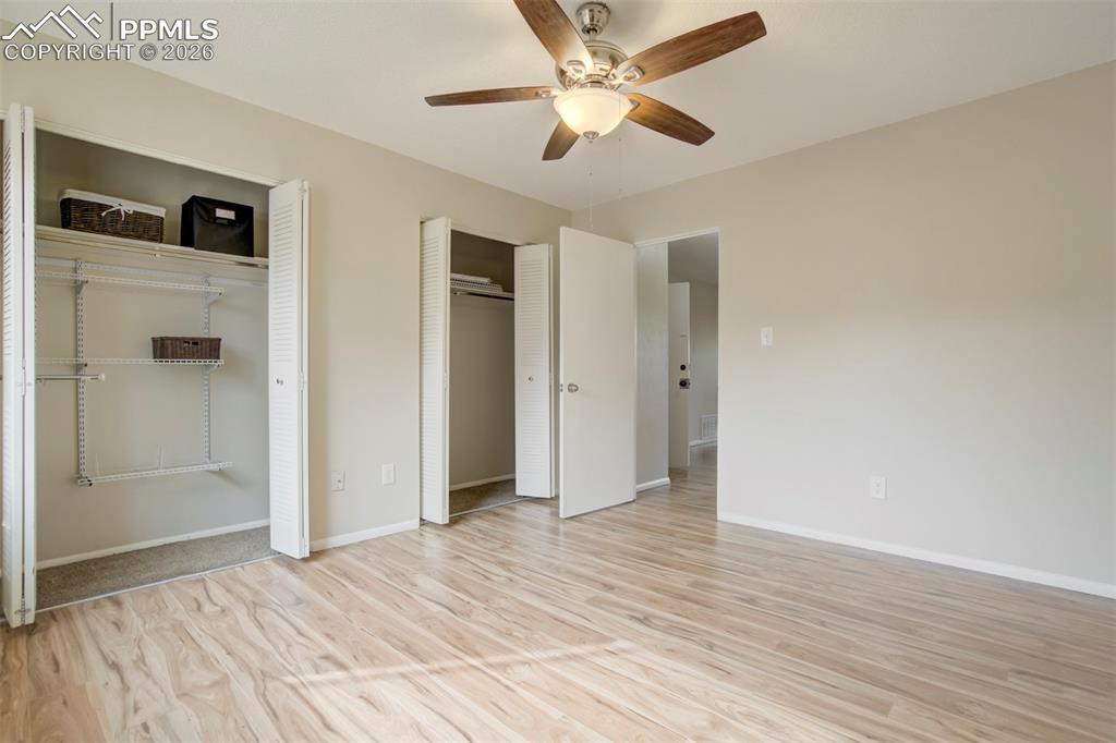 Image 10 of 25: Bedroom closets with entrance to living room.