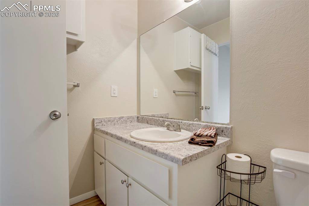 Image 13 of 25: Extra storage behind the door.