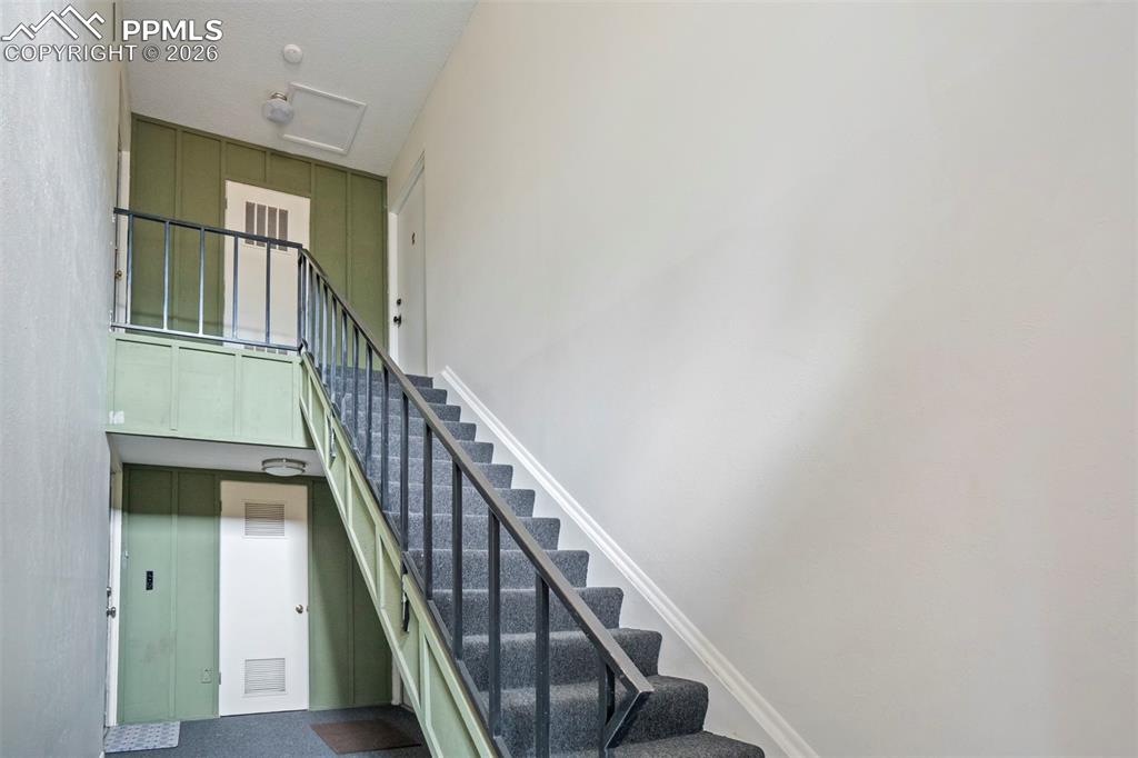 Image 17 of 25: Unit 264 is up the stairs on the right side.