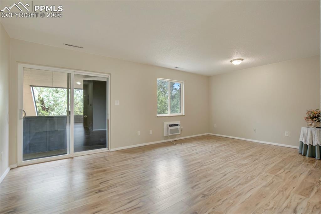 Image 3 of 25: Sliding glass door out to balcony. 