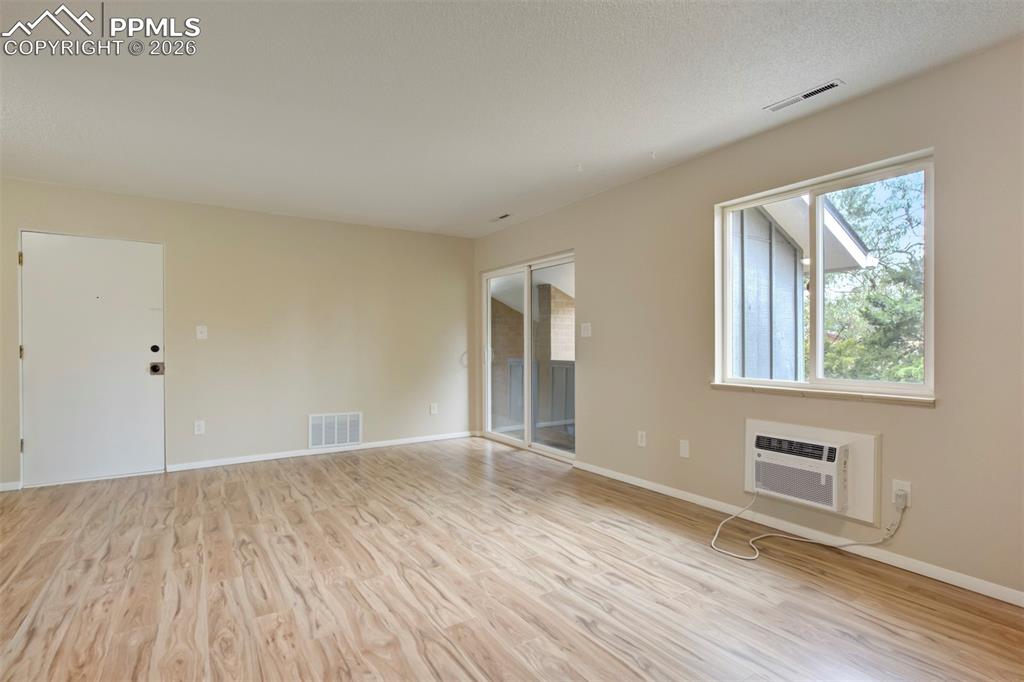 Image 5 of 25: New air conditioning unit in living room.