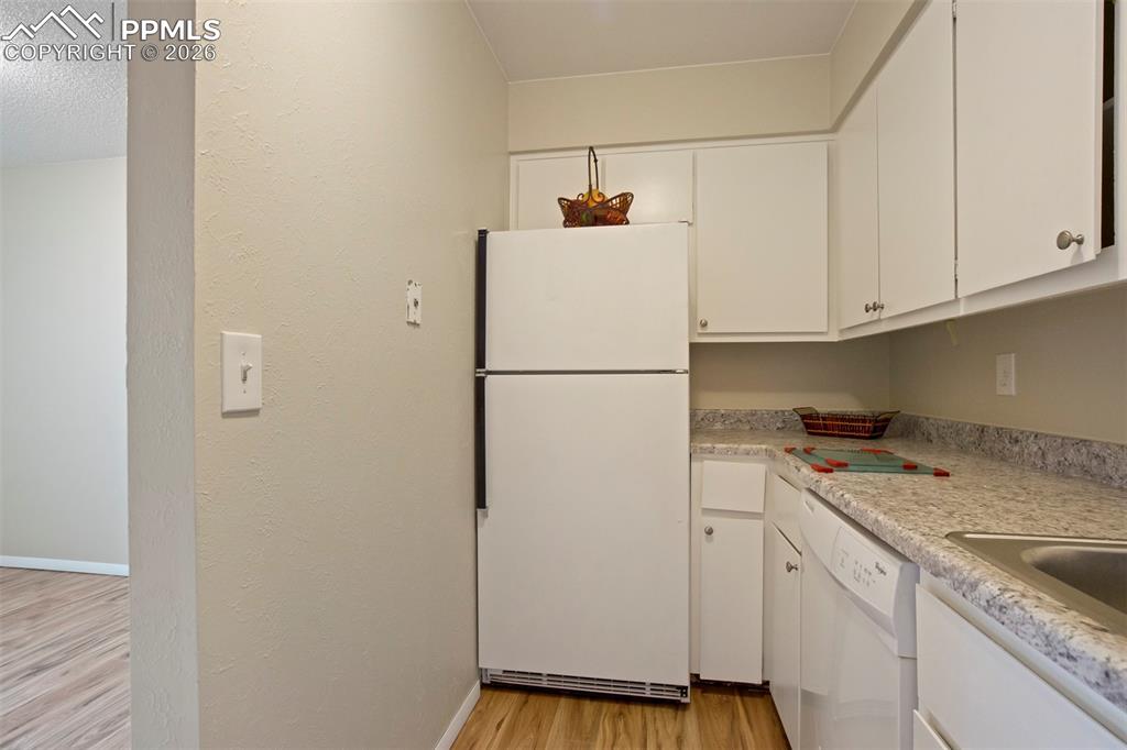 Image 6 of 25: Refrigerator side of kitchen.