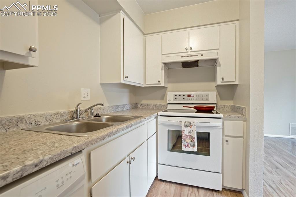 Image 7 of 25: Stove area of kitchen.