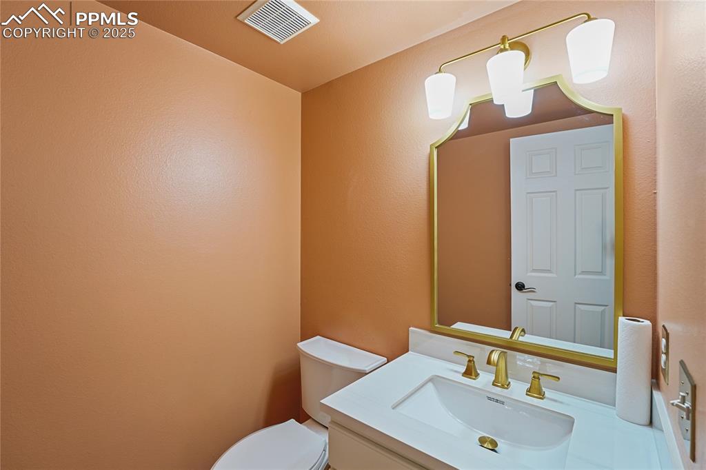 Image 12 of 45: Main Level Half Bathroom