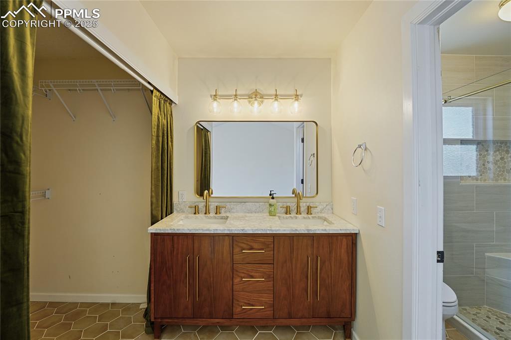 Image 15 of 45: Master Bathroom with Large Walk In Closet, Dual Vanity and shower