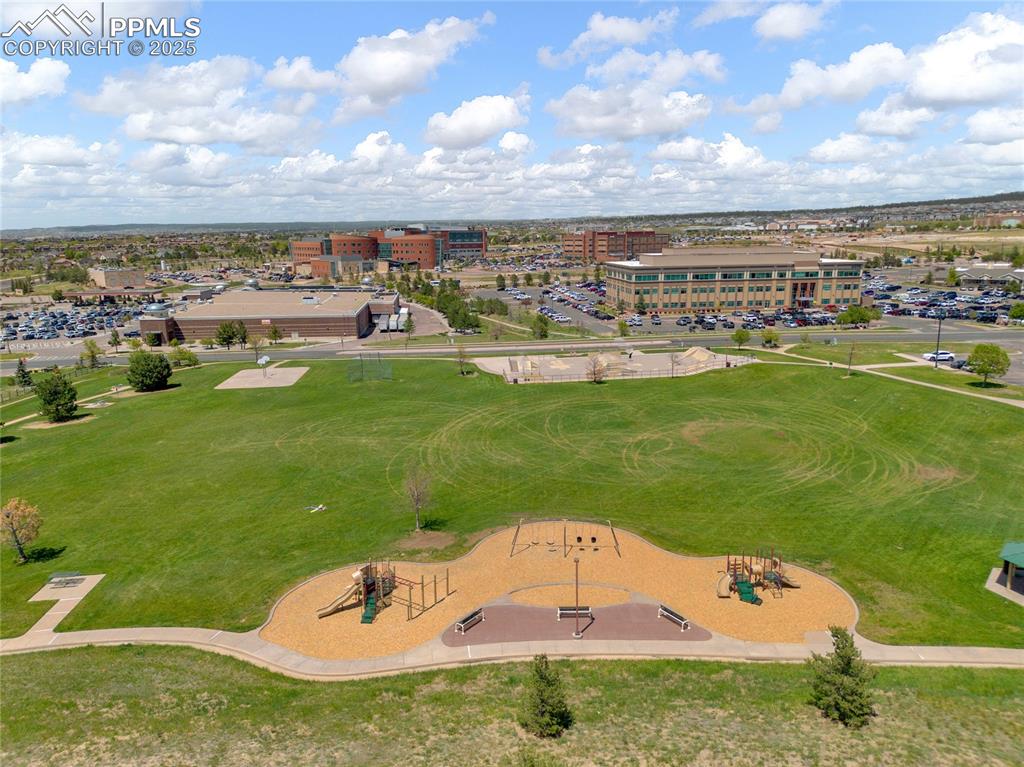 Image 43 of 45: City Park that borders the home property. Kids play area, large field and s