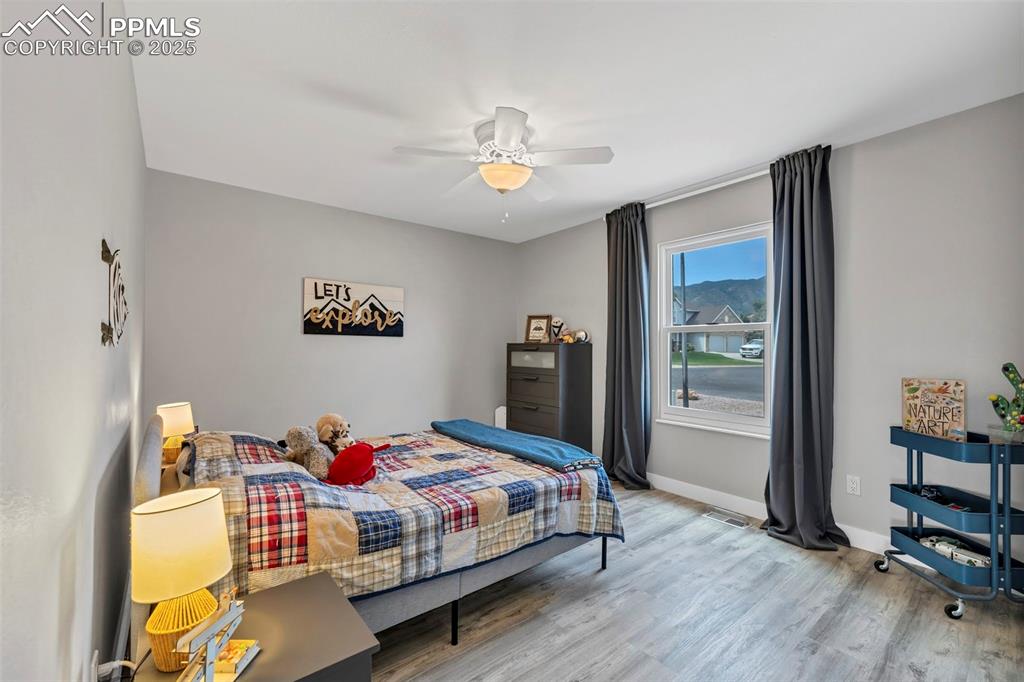 Image 16 of 50: The second bedroom has  a south-facing window.  