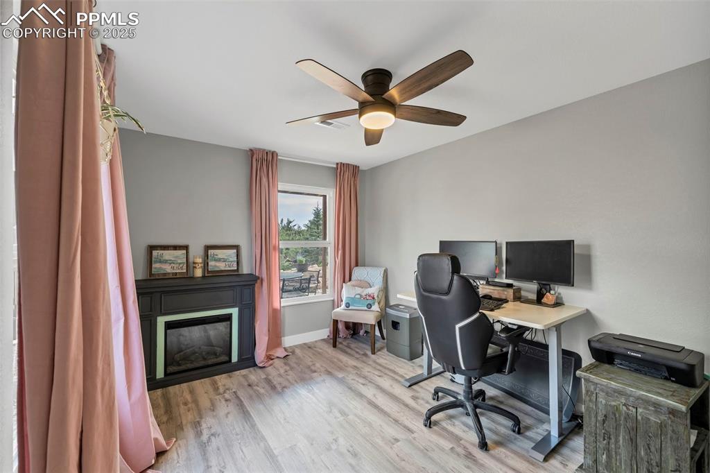 Image 24 of 50: The office is above grade offering a bright and open work space. 