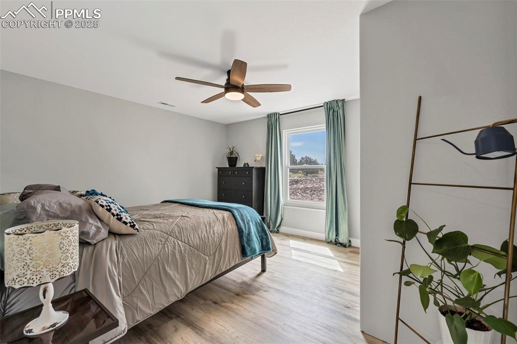 Image 26 of 50: The spacious 4th bedroom is in the southeast corner of the basement. 