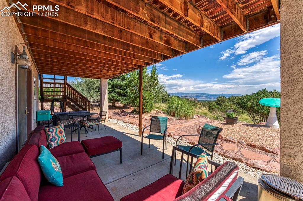 Image 30 of 50: The extended back patio offers another cool and comfortable outdoor living 