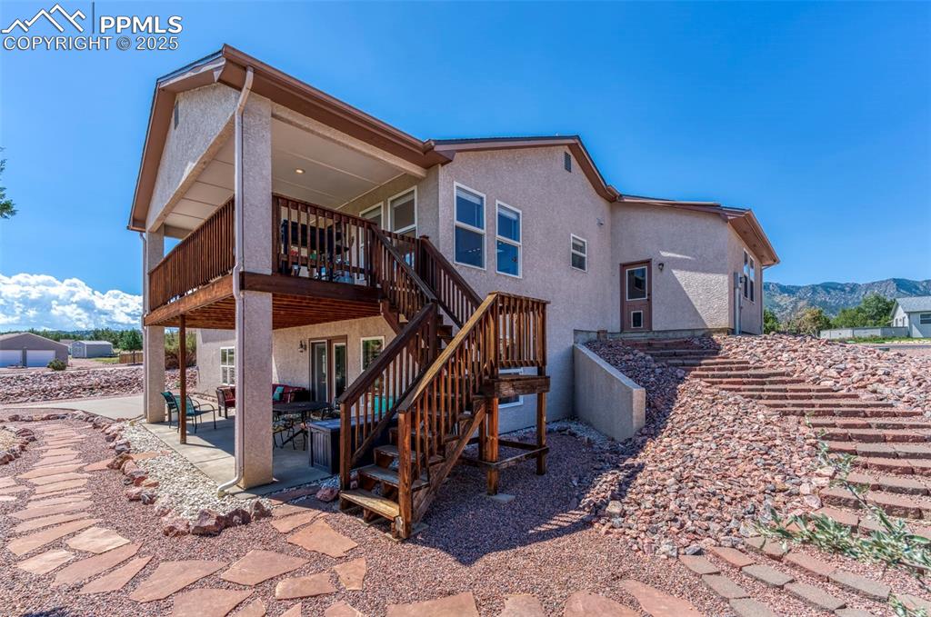 Image 34 of 50: This view shows the stairs from the deck and terraced steps leading to the 