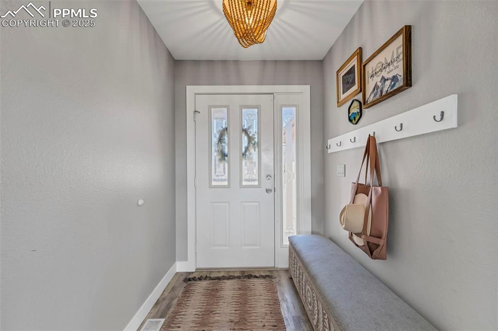 Image 9 of 50: The entry hall provides plenty of space to organize essential gear. 