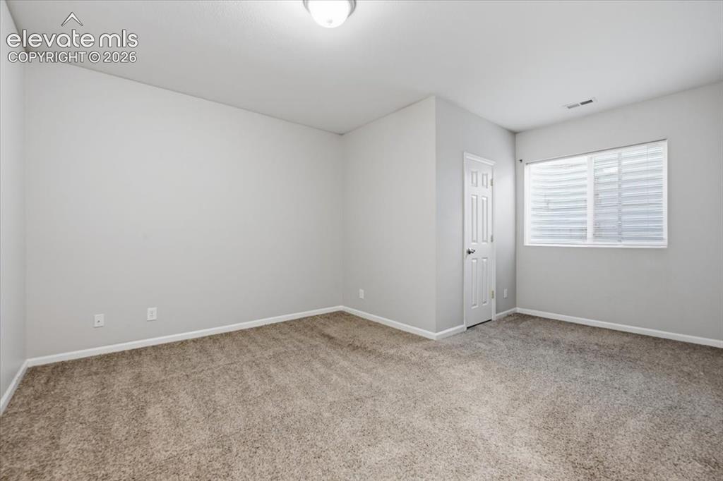 Image 36 of 44: Basement bedroom