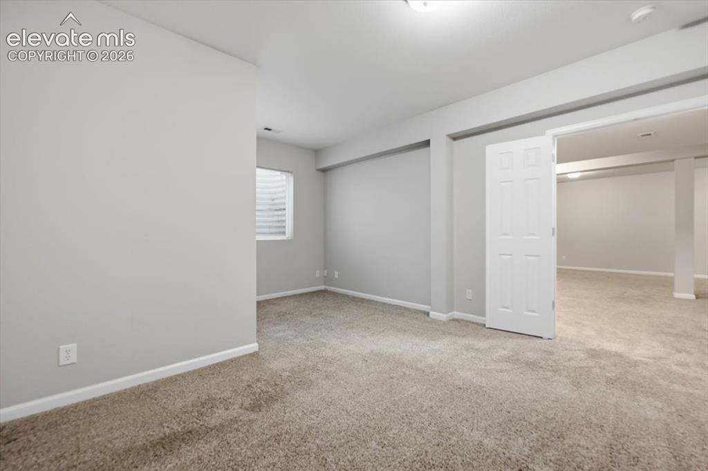 Image 37 of 44: Basement bedroom