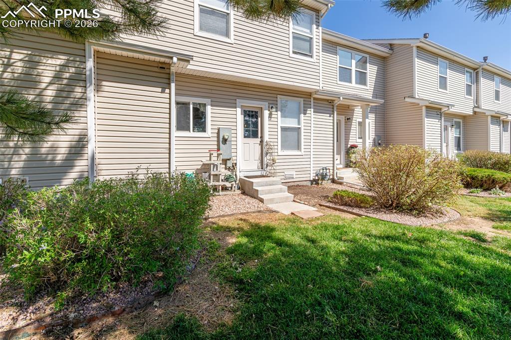 Image 32 of 34: View of front of house featuring a front lawn