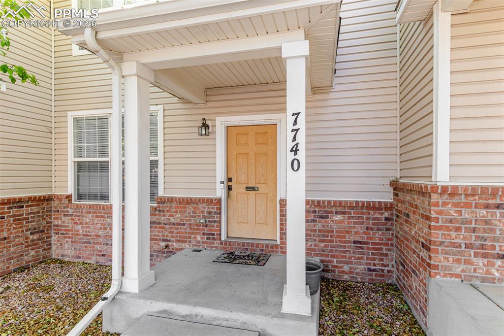 Image 4 of 34: View of exterior entry featuring covered porch