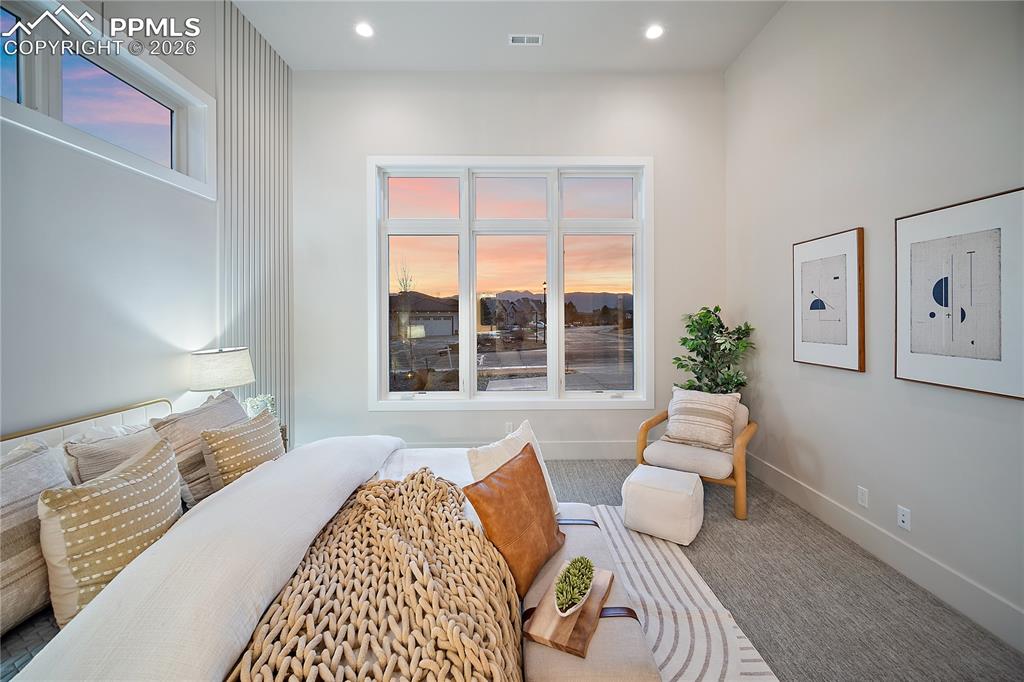 Image 16 of 43: Guest suite with views of the mountains, walk-in closet and a private ensui