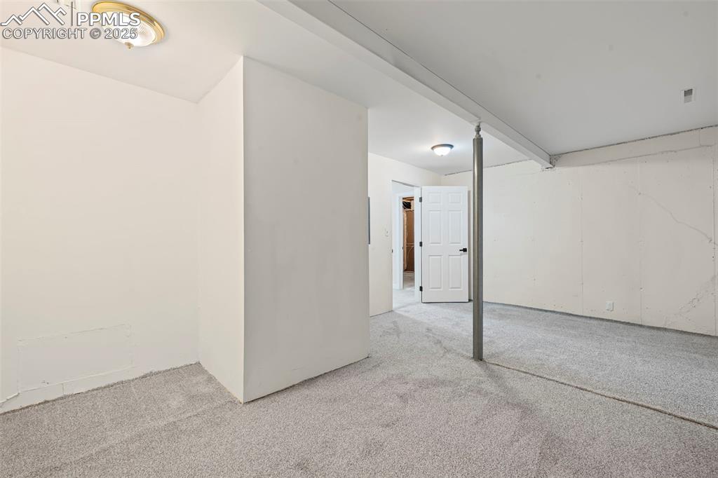 Image 43 of 48: Below grade area with carpet floors