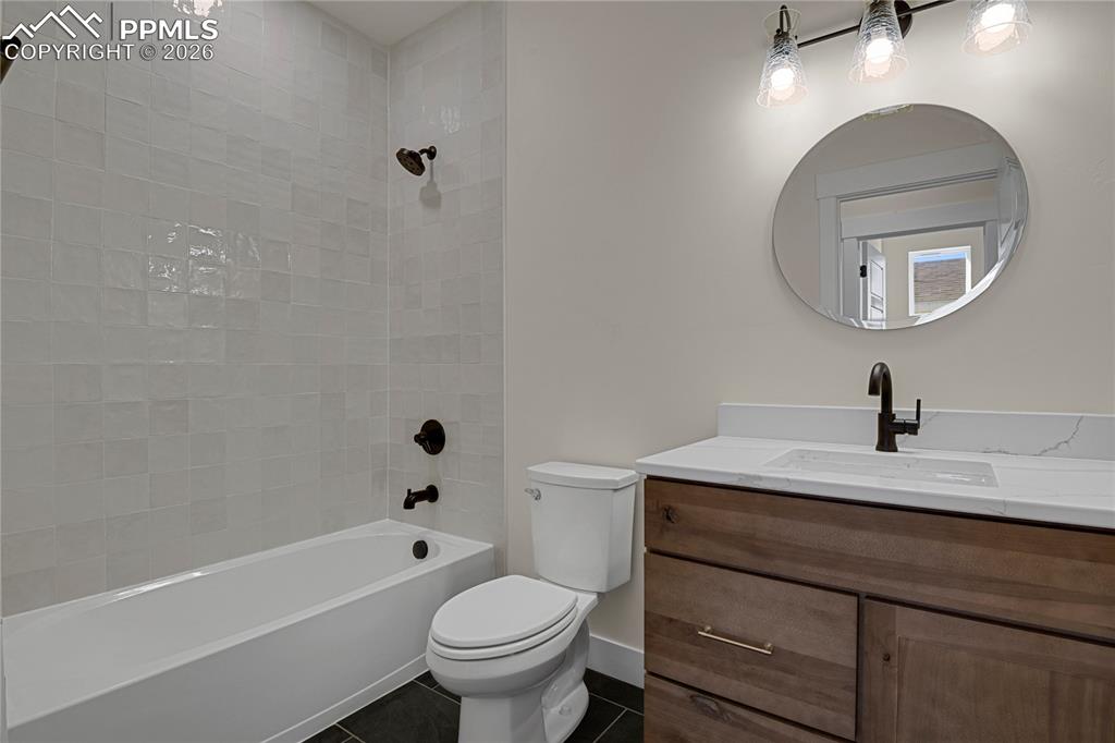 Image 24 of 42: Upstairs full bathroom