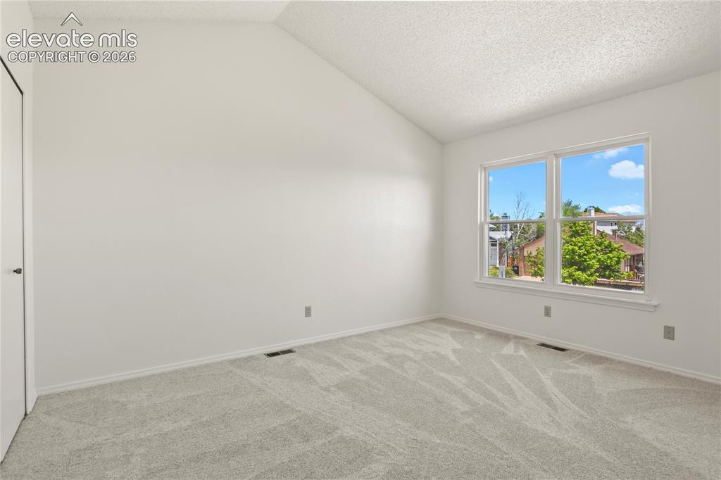 Image 19 of 33: Upper level bedroom