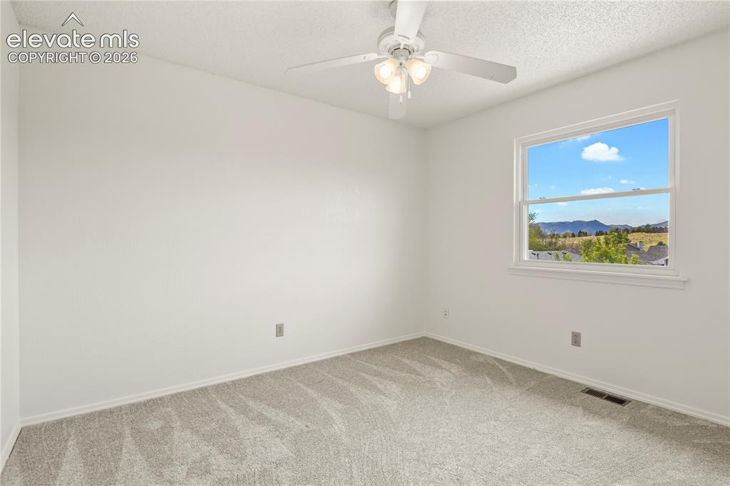 Image 23 of 33: Third upper level bedroom