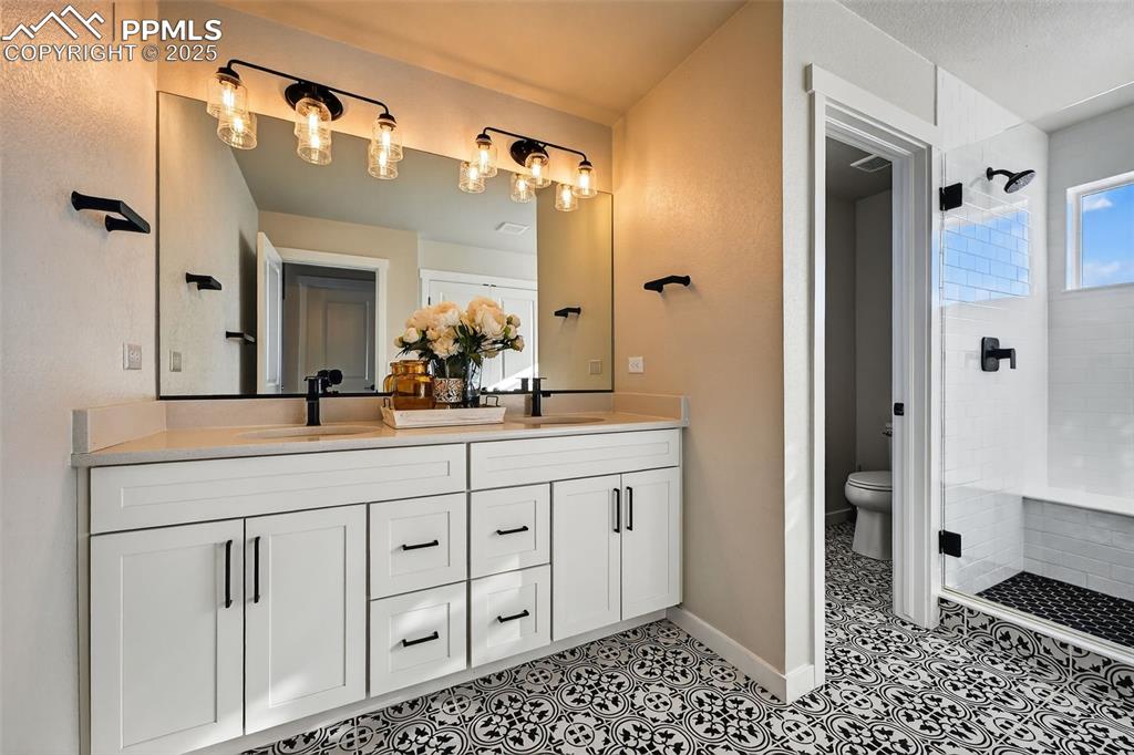 Image 21 of 43: Master Bath with updated finishes