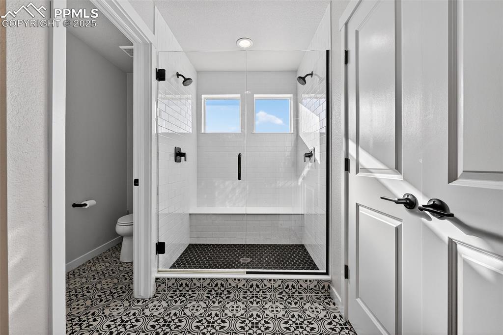 Image 22 of 43: Large walk-in shower and linen closet in Master Bath
