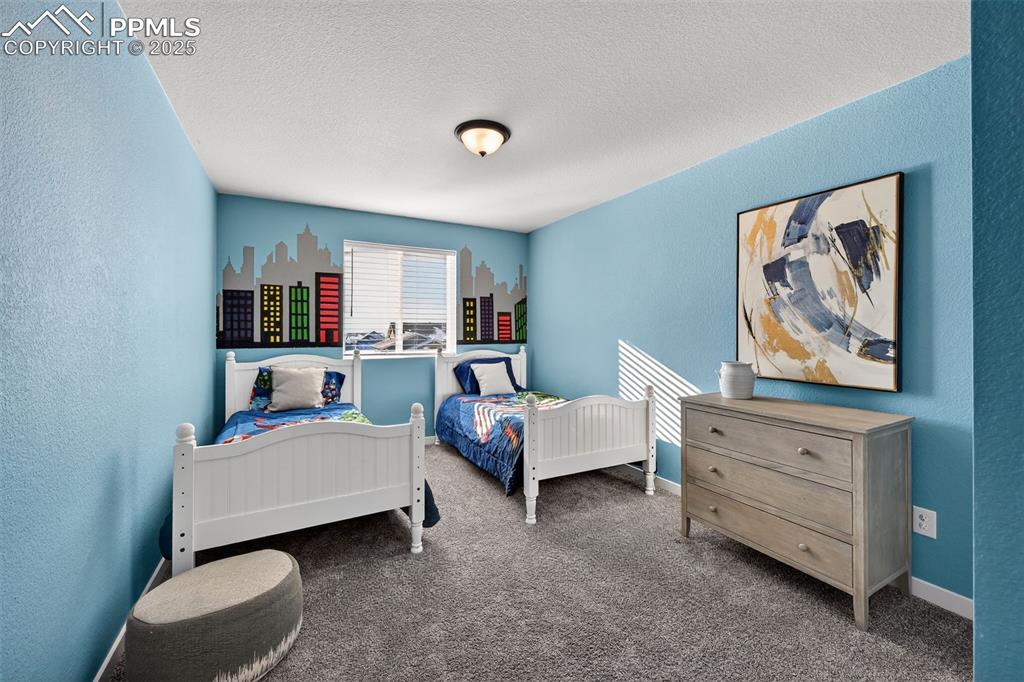 Image 24 of 43: Large secondary bedroom with walk-in closet