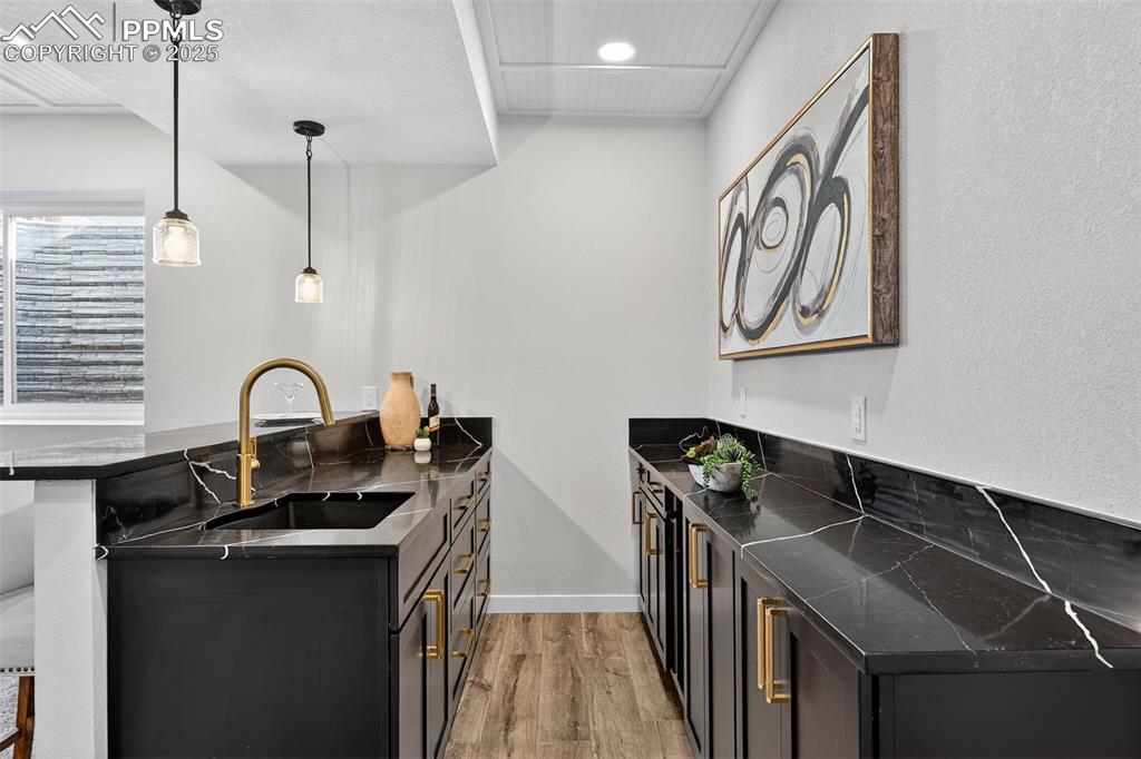 Image 33 of 43: Updated basement wet bar