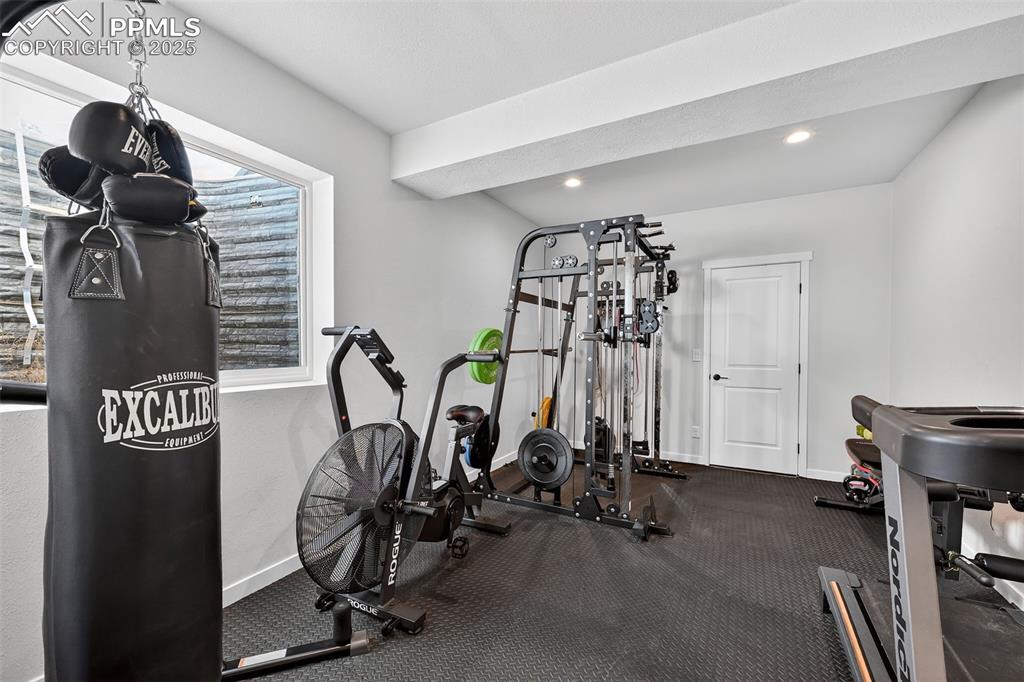 Image 35 of 43: Finished gym space with large window and tons of natural light!