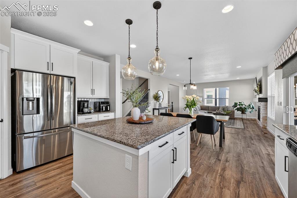 Image 9 of 43: Open concept from kitchen to nook 