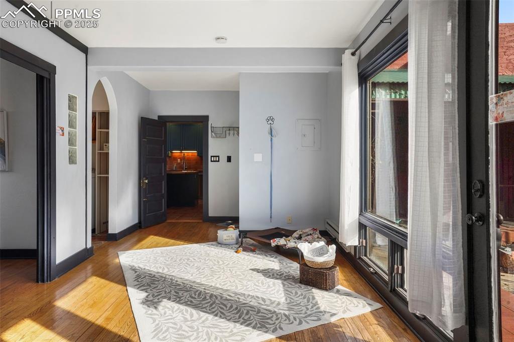 Image 33 of 47: Side entrance foyer /sunroom looking towards kitchen