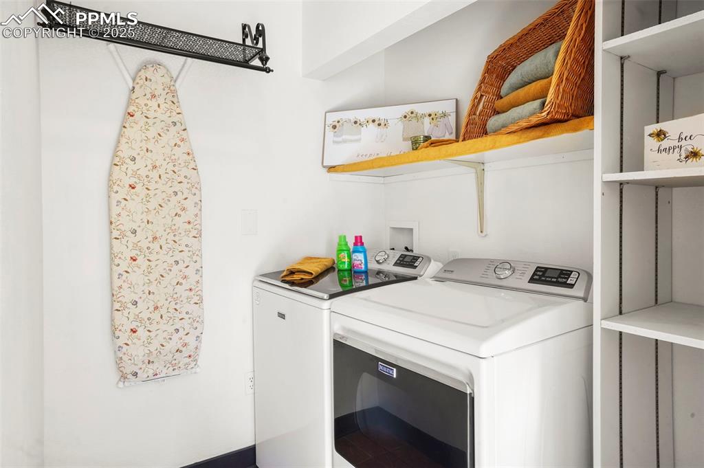 Image 37 of 47: Featuring washer/dryer hookups laundry area and storage