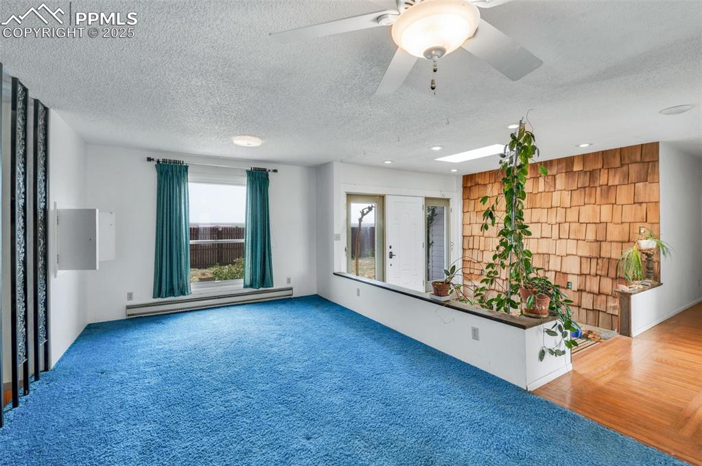 Image 11 of 50: Dining room open to the entry space