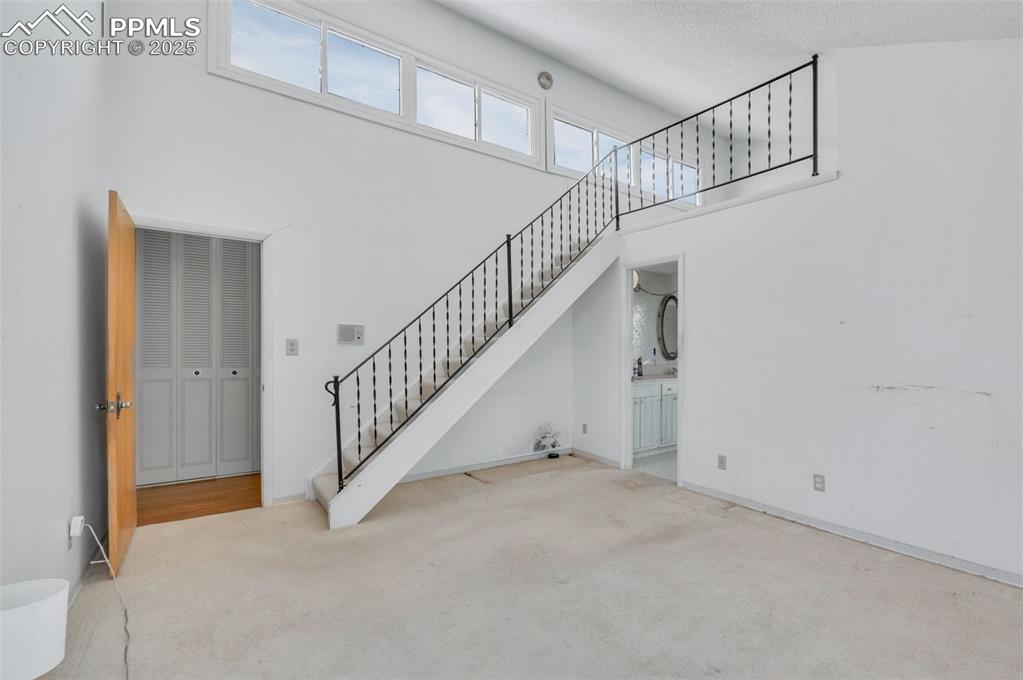 Image 20 of 50: Stairs lead to the loft study