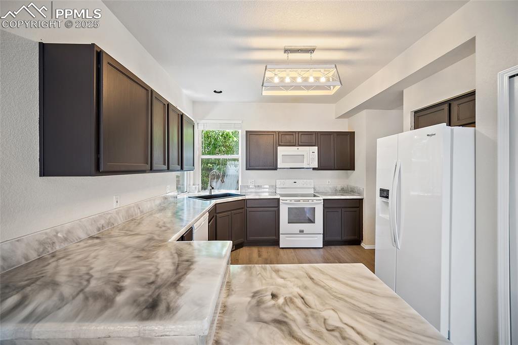 Image 13 of 46: Double windows in the kitchen allowing plenty of natural light. 