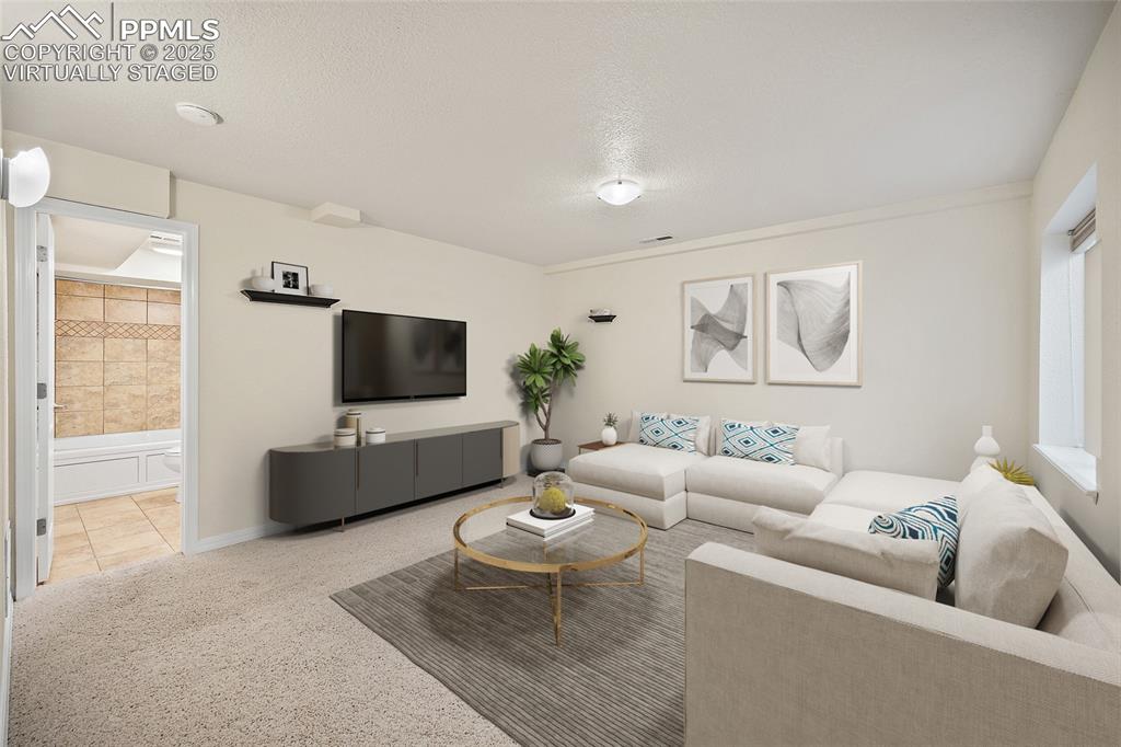 Image 34 of 46: virtually staged - extra room in the basement. Could be a 4th bedroom bath 
