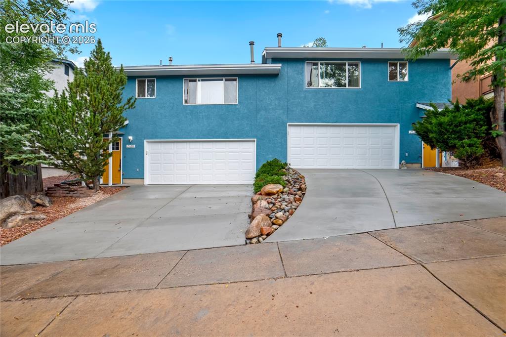 Caption: Stucco exterior in a vibrant blue finish
