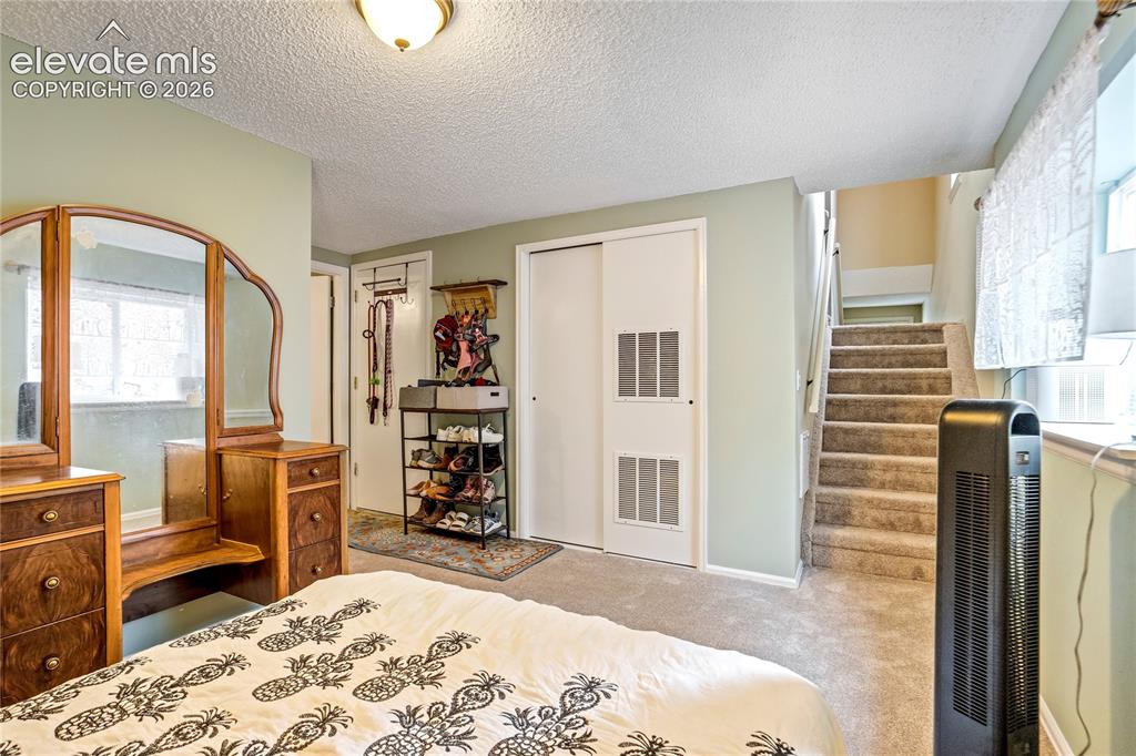 Image 16 of 50: Light-colored wall paint, white trim, and carpeted flooring throughout