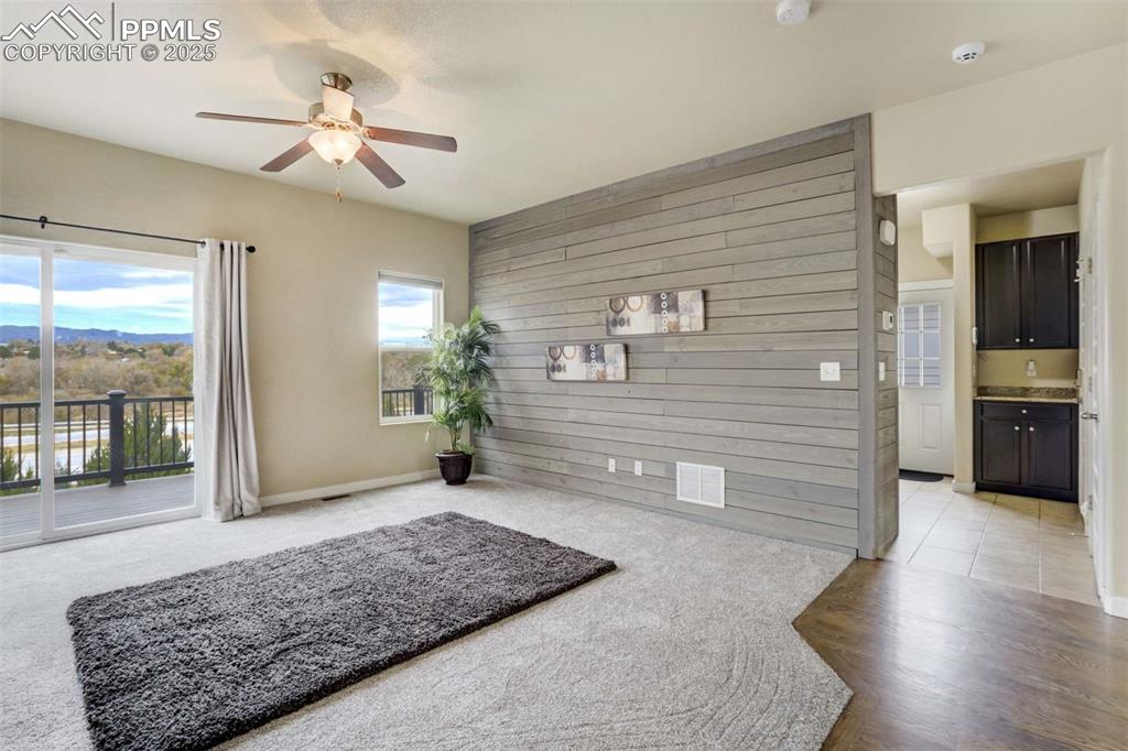 Image 10 of 50: Living Room & Accent Wall – This inviting space highlights a modern wood ac
