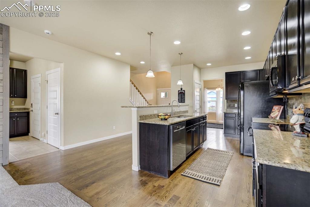 Image 13 of 50: Kitchen Toward Entry – Long countertop runs and abundant cabinetry provide 
