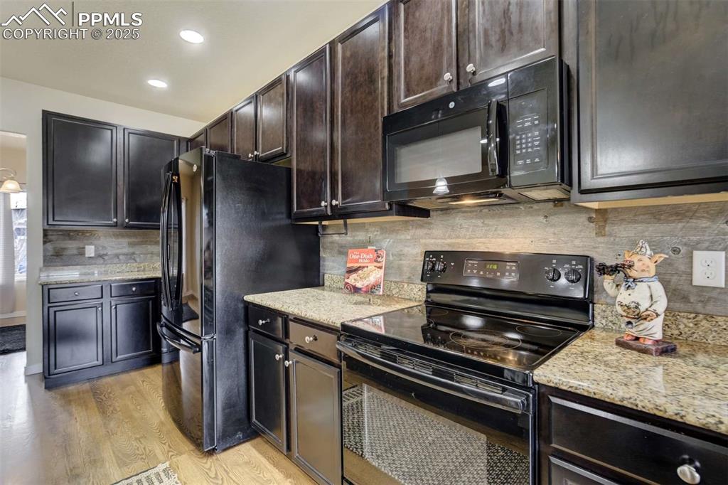 Image 14 of 50: Kitchen Appliances & Cabinetry – Close-up of the kitchen’s ample storage, m