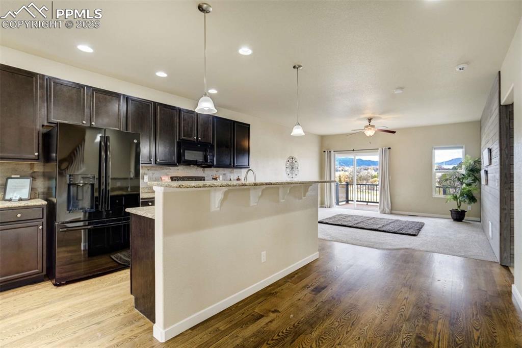 Image 15 of 50: Kitchen to Living Room View – Open-concept sightline from the kitchen to th