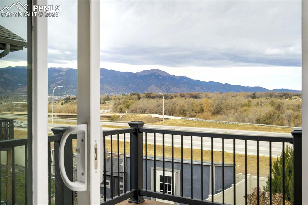 Image 17 of 50: Deck View – Scenic balcony-style views of the surrounding foothills and ope