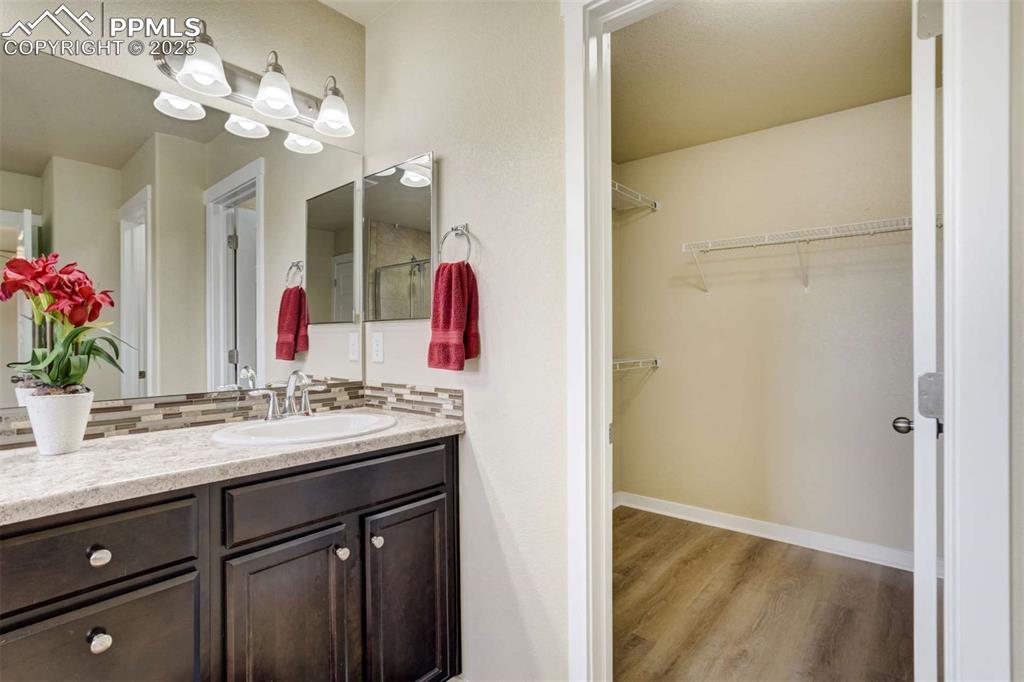 Image 29 of 50: Primary Closet Entry – Spacious walk-in closet located directly off the pri