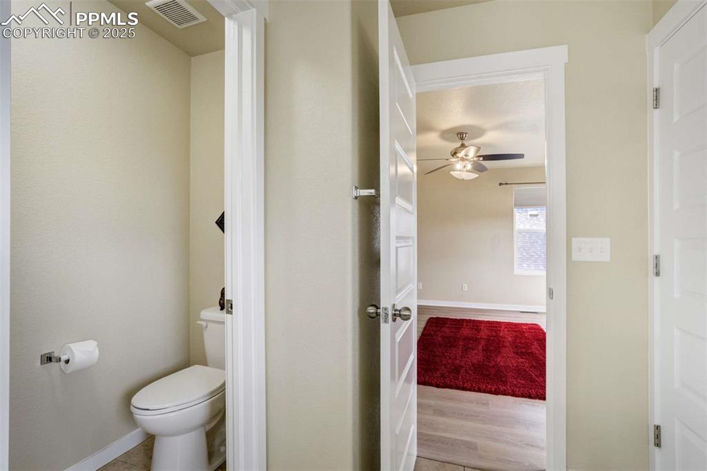 Image 30 of 50: Primary Water Closet – Private enclosed toilet area within the primary bath