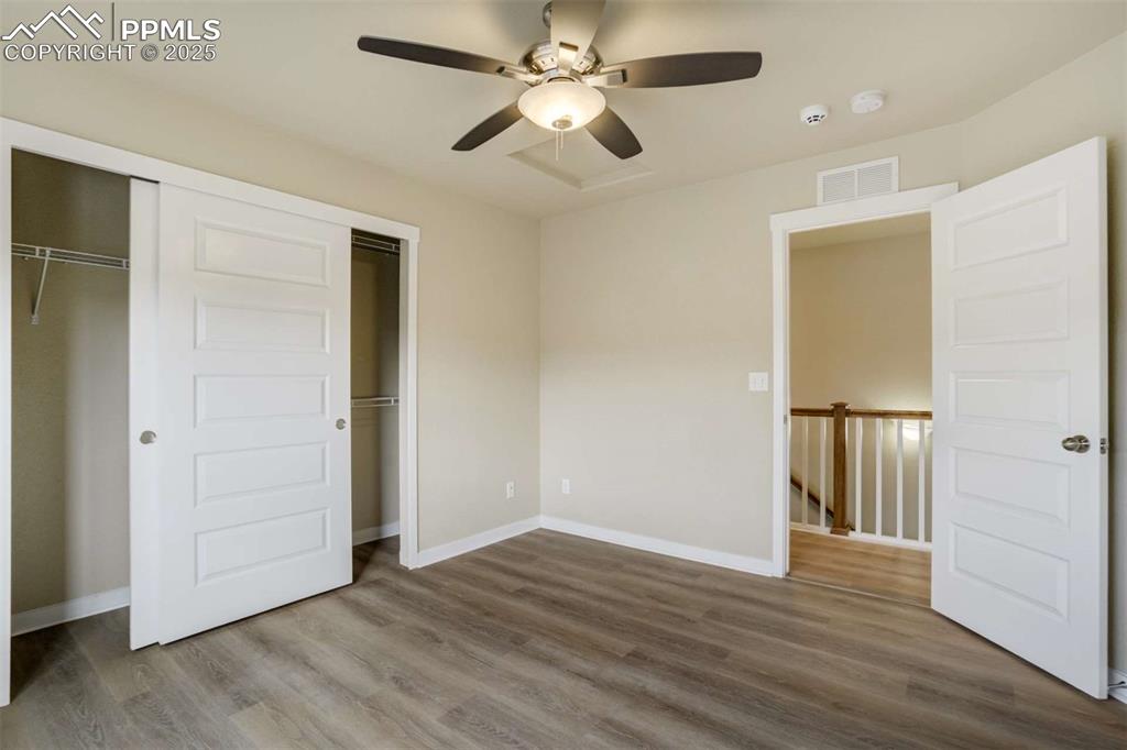Image 32 of 50: Bedroom 2 (Alternate View) – View showing the roomy closet with sliding doo